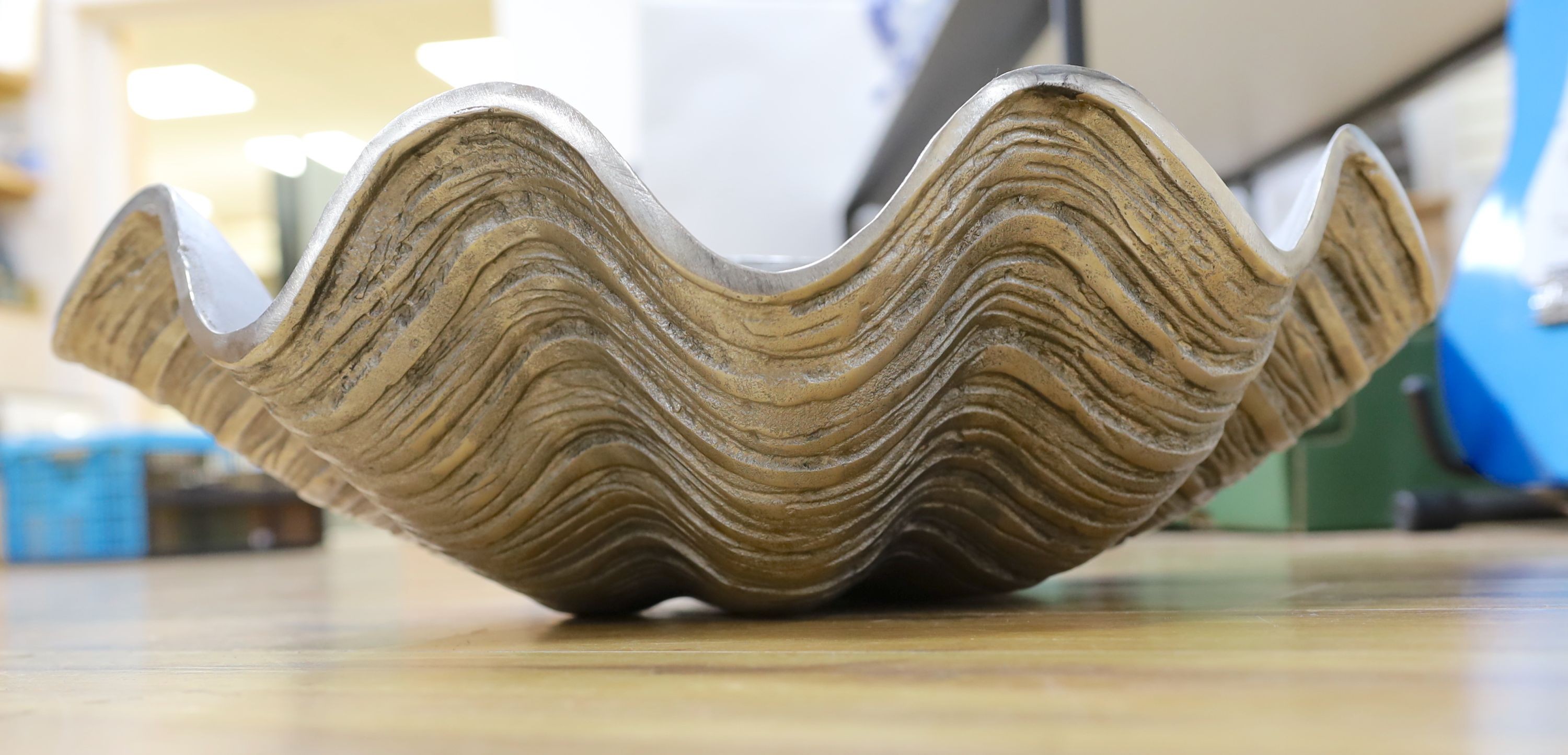 A cast aluminium clam-shaped ice bucket, 66 cms wide.